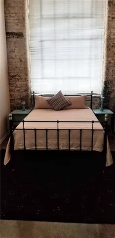 a view of a balcony with furniture