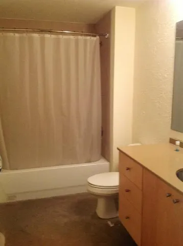 a bathroom with a toilet and a sink