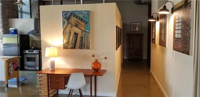 a dining room with furniture and a chandelier