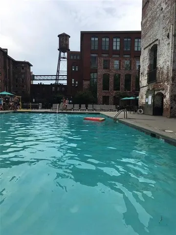a view of a house with backyard porch and garden