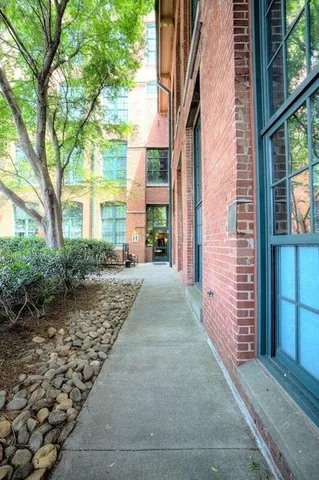 a view of a pathway both side of house
