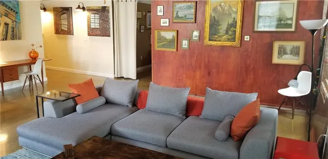 a living room with furniture and a couch