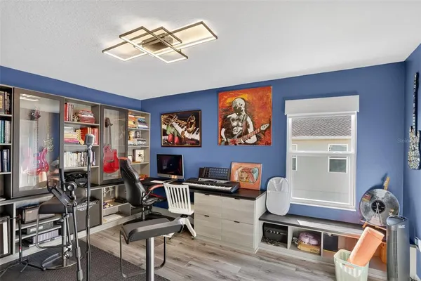 a bedroom with a bed dresser and a window