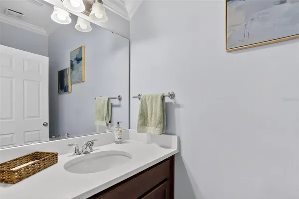 a patio with water slide dining table and chairs