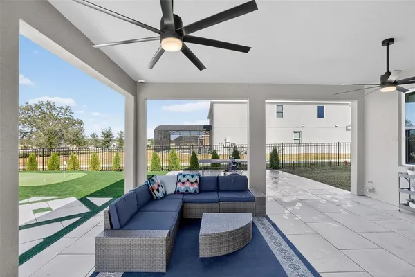 a front view of house with swimming pool yard and outdoor seating