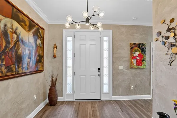 a view of a dining room with furniture and window