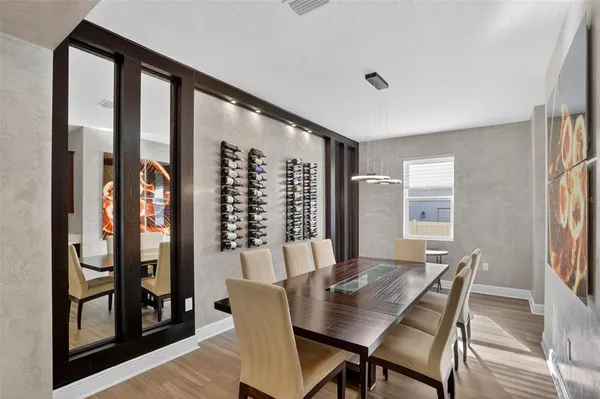 a view of swimming pool with seating area and barbeque oven