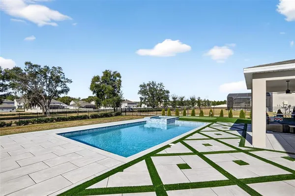 a kitchen with stainless steel appliances sink stove microwave and cabinets