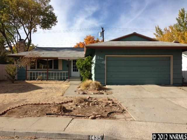 1435 Samuel Way Reno, NV 89509 - Photo 1 of 1 a front view of a house with a yard