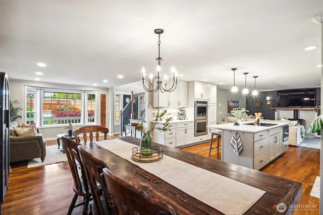 a large kitchen with a table and chairs