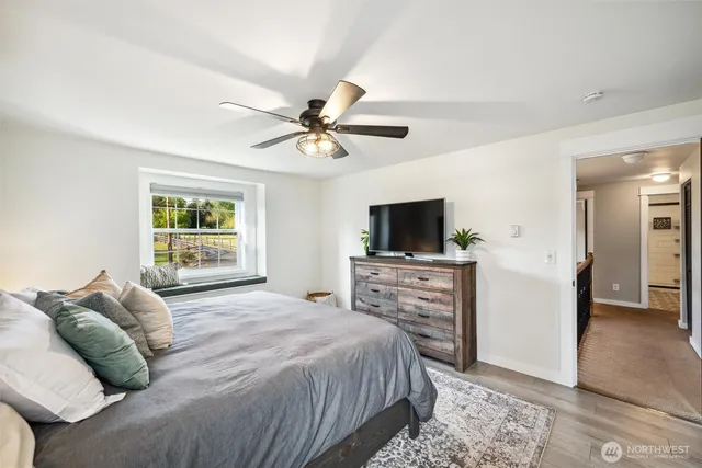 a bedroom with a bed and a chandelier