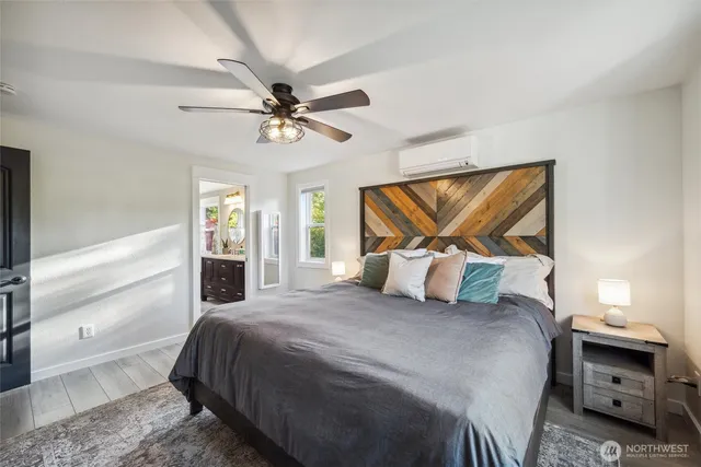 a bathroom with a double vanity sink mirror and bathtub