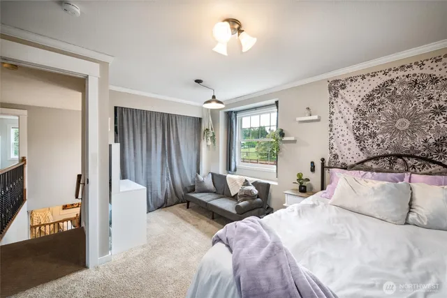 a bedroom with a bed and a couch