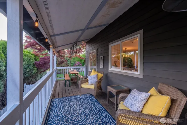a view of balcony with couch and outdoor seating