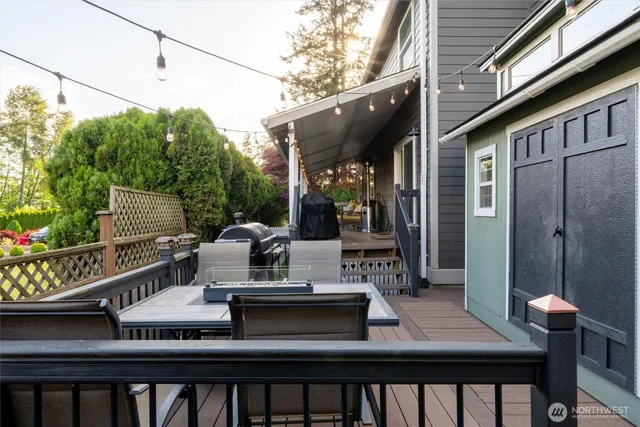 a view of a dinning room with a table and chairs