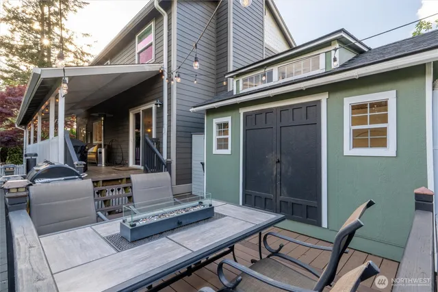 a view of a house with a yard and sitting area