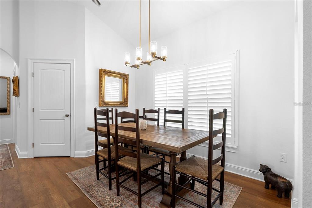 700 Old Geneva Road Geneva, FL 32732 - Photo 14 of 79 a view of a dining room with furniture and a chandelier