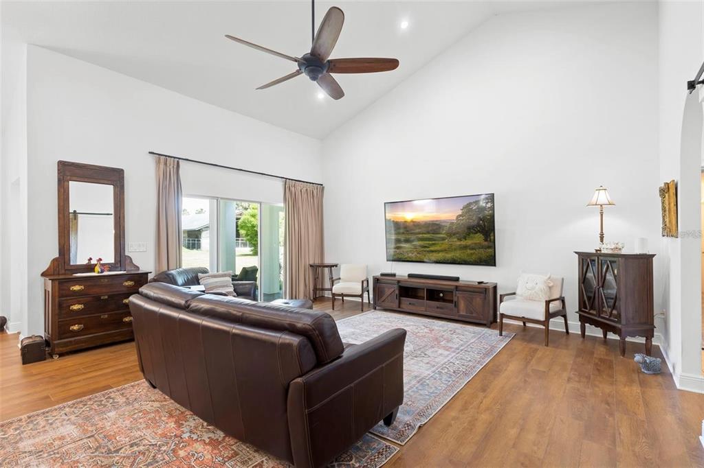700 Old Geneva Road Geneva, FL 32732 - Photo 15 of 79 a living room with furniture and a flat screen tv