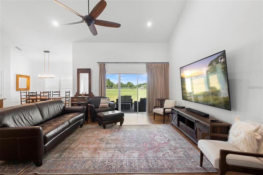 700 Old Geneva Road Geneva, FL 32732 - Photo 16 of 79 a living room with furniture and a flat screen tv