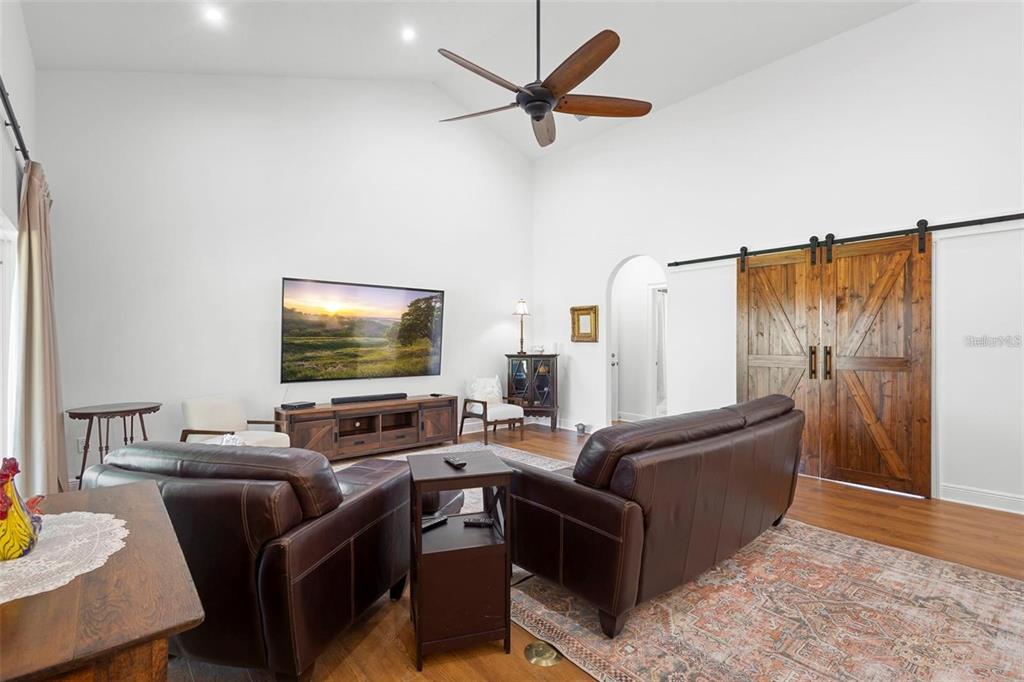 700 Old Geneva Road Geneva, FL 32732 - Photo 17 of 79 a living room with furniture and a flat screen tv