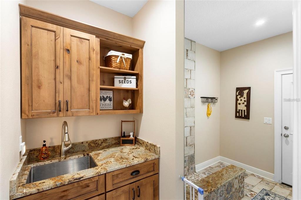 700 Old Geneva Road Geneva, FL 32732 - Photo 27 of 79 a kitchen with a sink and cabinets