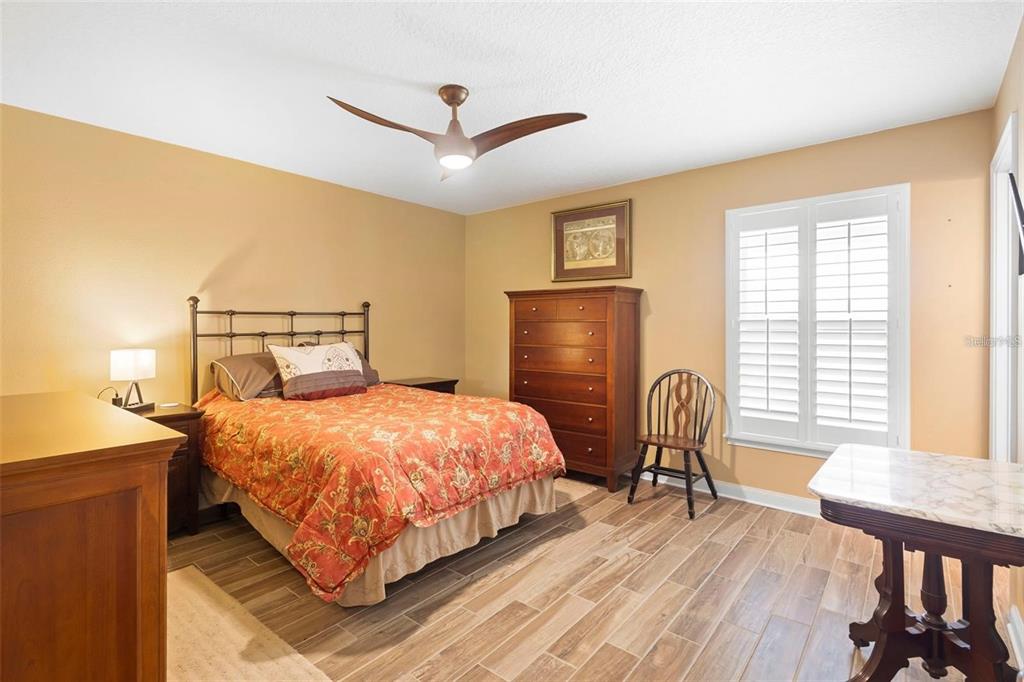 700 Old Geneva Road Geneva, FL 32732 - Photo 35 of 79 a bedroom with a bed and a table with chair