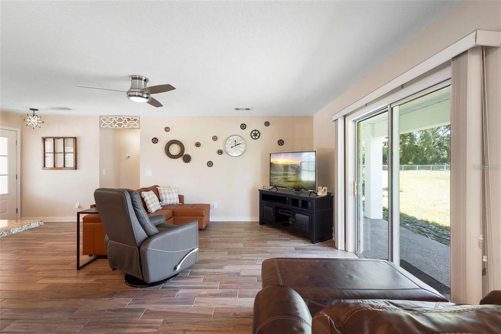 700 Old Geneva Road Geneva, FL 32732 - Photo 46 of 79 a living room with furniture and wooden floor