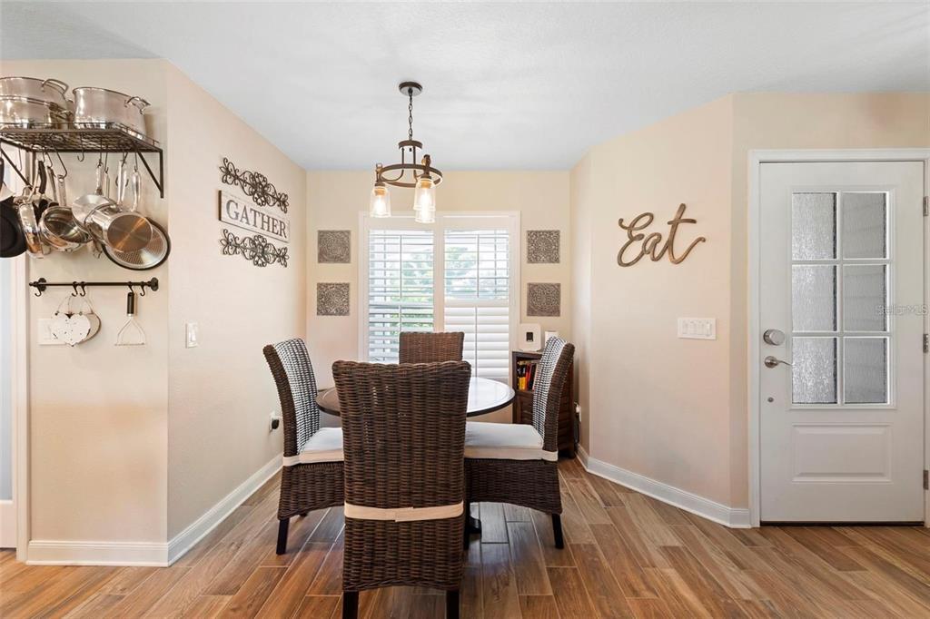 700 Old Geneva Road Geneva, FL 32732 - Photo 52 of 79 a view of a dining room with furniture window and wooden floor