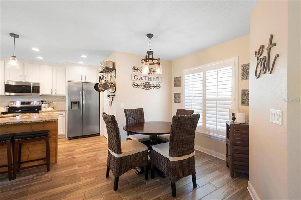 700 Old Geneva Road Geneva, FL 32732 - Photo 53 of 79 a view of a dining room with furniture window and wooden floor