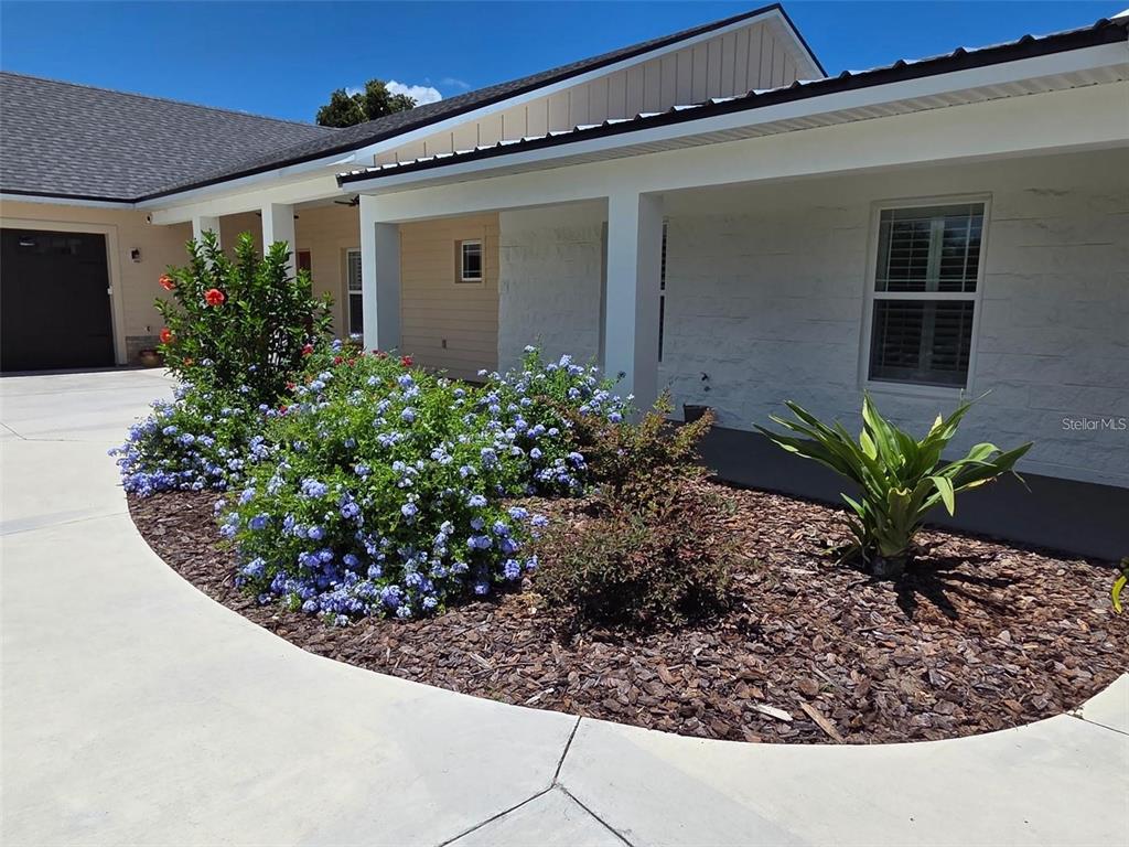 700 Old Geneva Road Geneva, FL 32732 - Photo 75 of 80 a view of a house with a flower garden