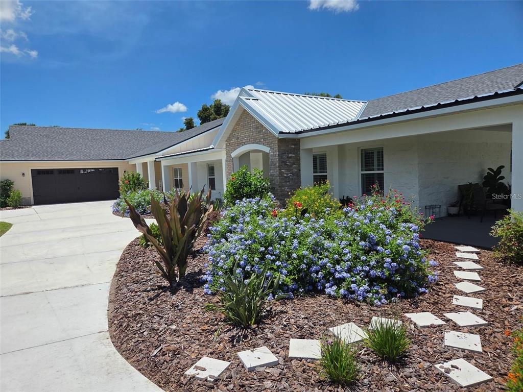 700 Old Geneva Road Geneva, FL 32732 - Photo 75 of 79 a front view of a house with garden