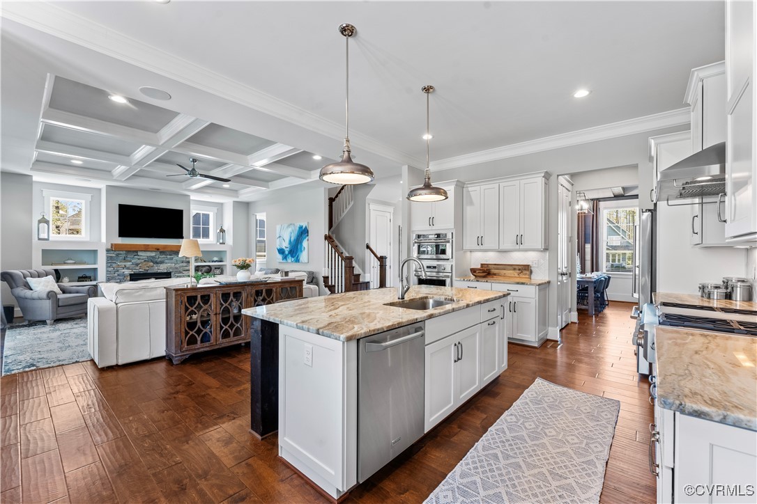 2437 Mitchells Mill Drive Midlothian, VA 23112 - Photo 15 of 50 a large kitchen with kitchen island lots of counter space a sink appliances and a living room view