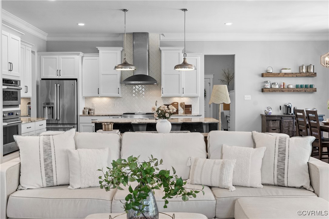 2437 Mitchells Mill Drive Midlothian, VA 23112 - Photo 18 of 50 a large kitchen with white cabinets and stainless steel appliances