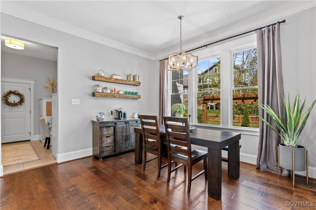2437 Mitchells Mill Drive Midlothian, VA 23112 - Photo 19 of 50 a view of a dining room with furniture window and wooden floor