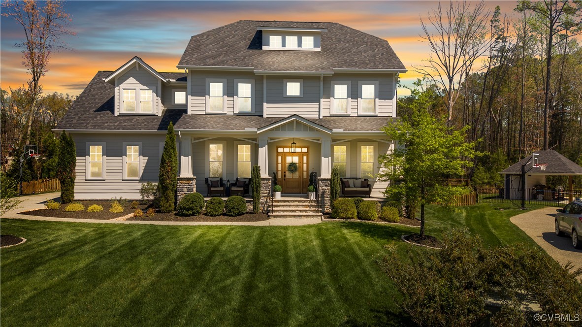 2437 Mitchells Mill Drive Midlothian, VA 23112 - Photo 2 of 50 a front view of a residential apartment building with a yard