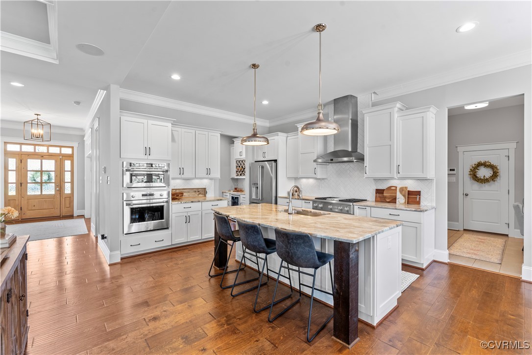 2437 Mitchells Mill Drive Midlothian, VA 23112 - Photo 24 of 50 a kitchen with a stove a refrigerator and a stove top oven