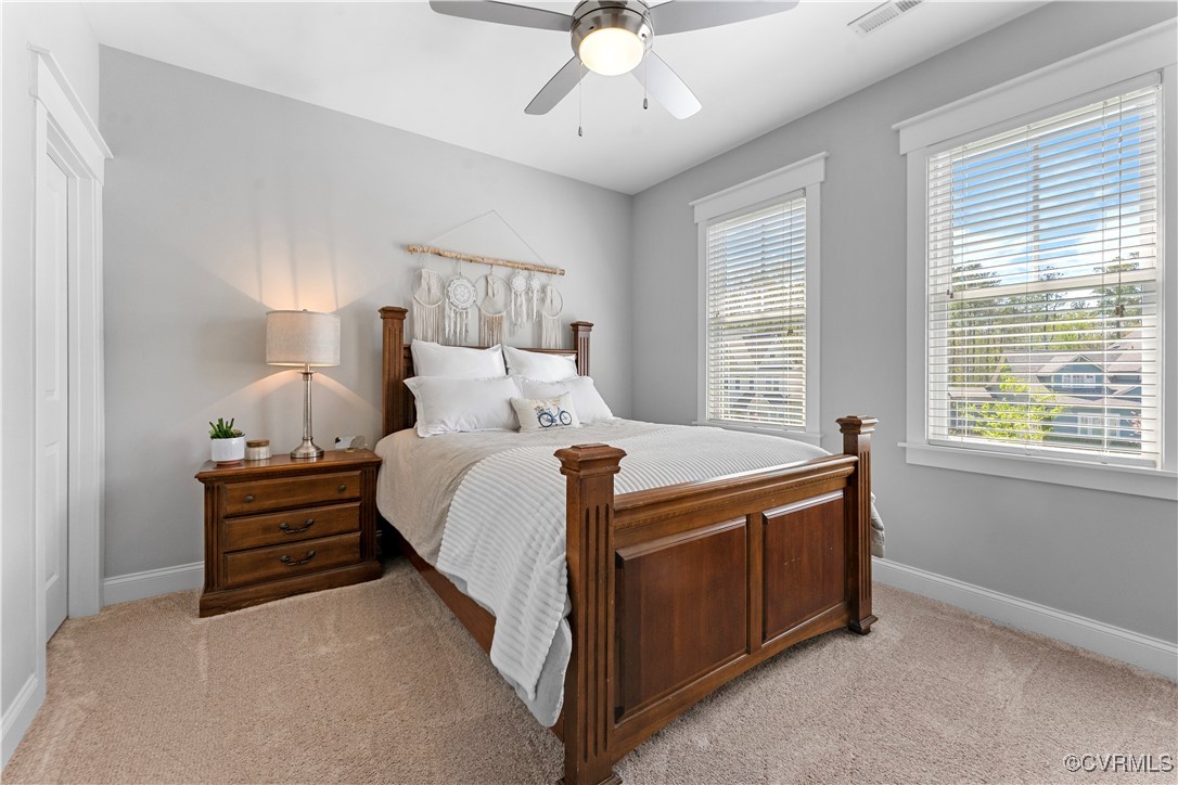 2437 Mitchells Mill Drive Midlothian, VA 23112 - Photo 30 of 50 a bed room with a bed and a ceiling fan