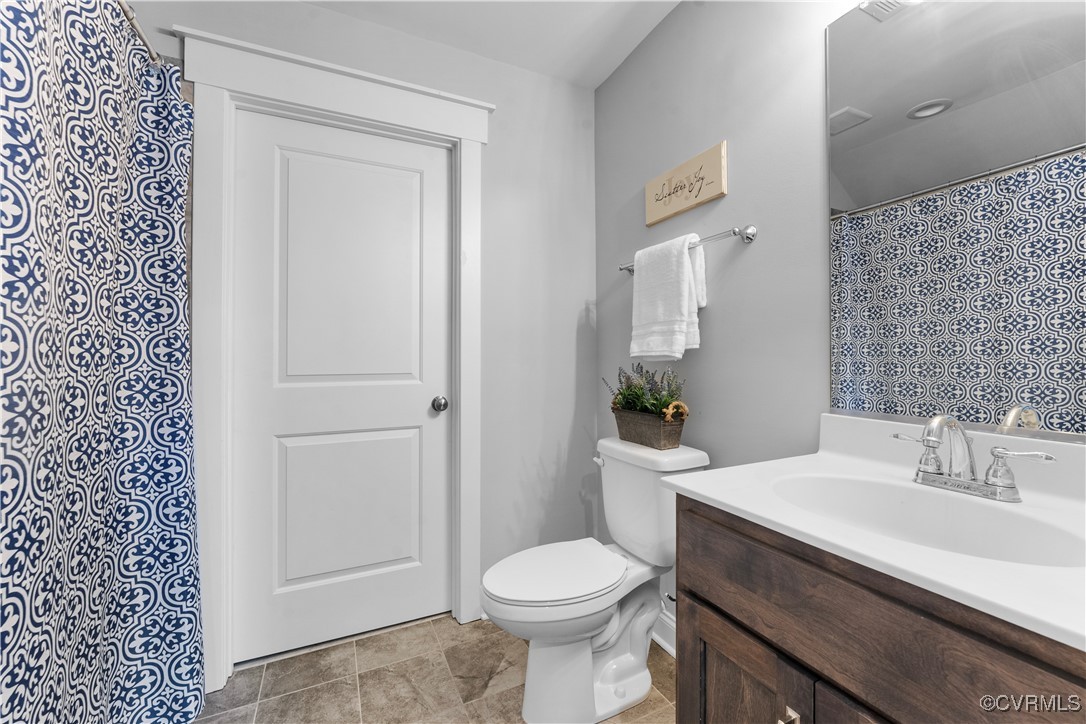 2437 Mitchells Mill Drive Midlothian, VA 23112 - Photo 41 of 50 a bathroom with a sink a toilet and shower