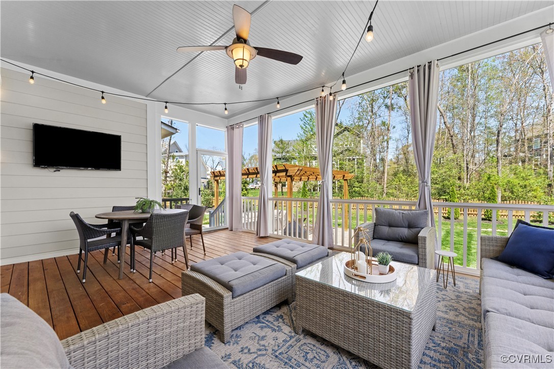 2437 Mitchells Mill Drive Midlothian, VA 23112 - Photo 42 of 50 a living room with furniture a flat screen tv and a large window