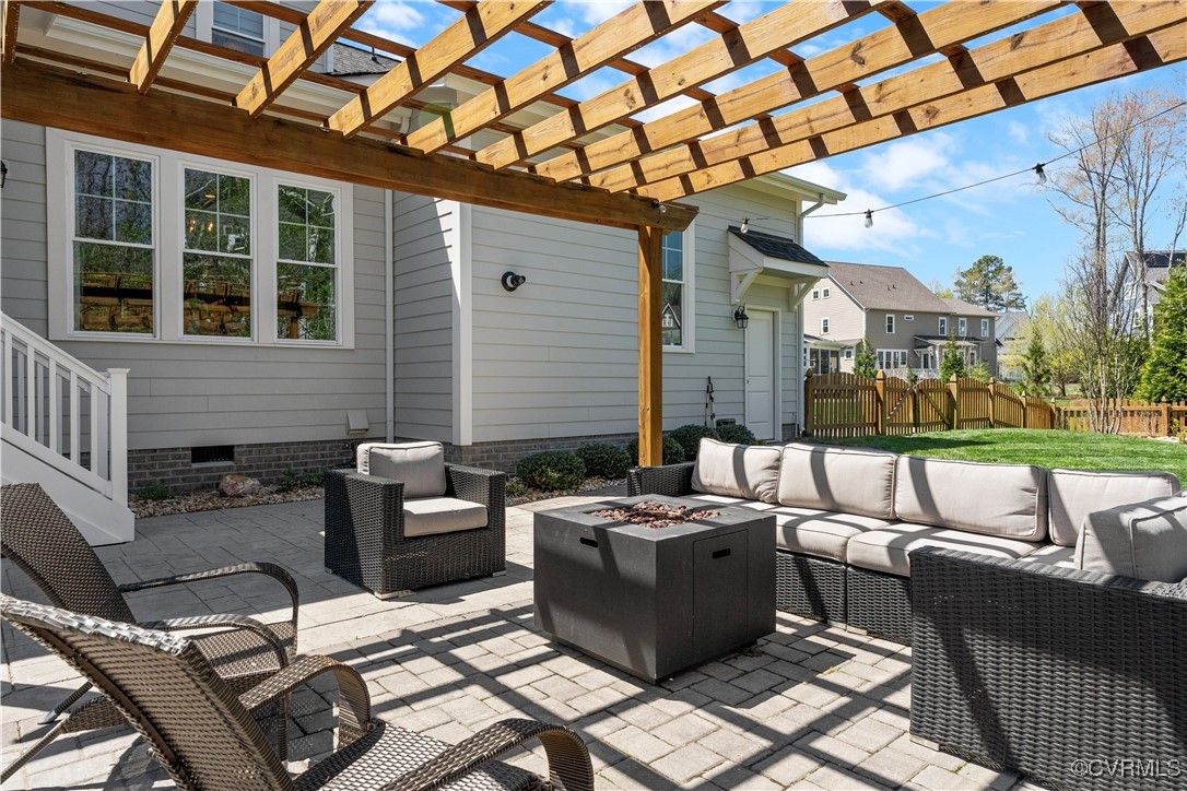 2437 Mitchells Mill Drive Midlothian, VA 23112 - Photo 44 of 50 a view of a patio with couches table and chairs with garden view
