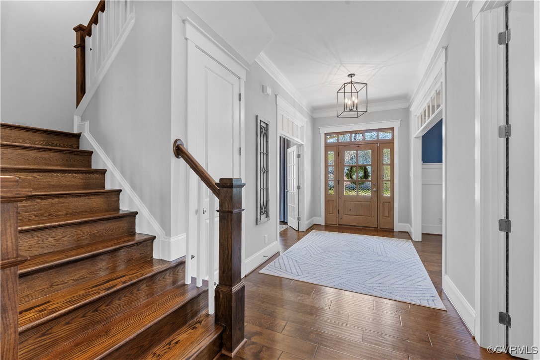 2437 Mitchells Mill Drive Midlothian, VA 23112 - Photo 5 of 50 a view of a hallway with wooden floor and staircase