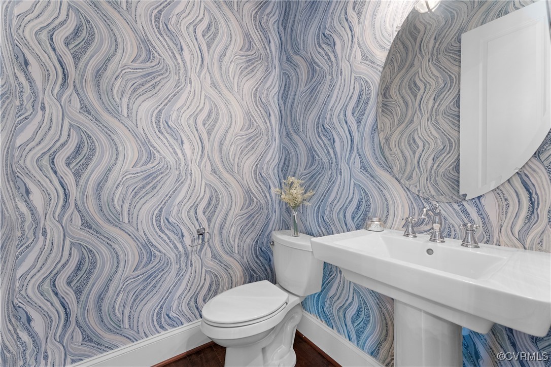 2437 Mitchells Mill Drive Midlothian, VA 23112 - Photo 9 of 50 a bathroom with a toilet and a sink