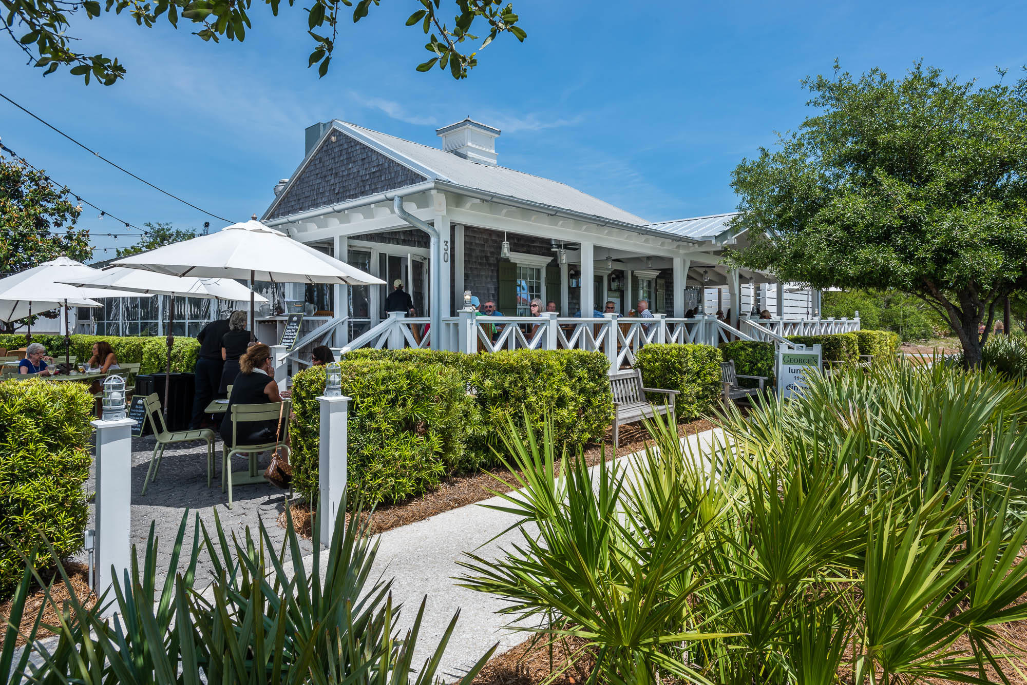46 Sea Venture Alley Inlet Beach, FL 32461 - Photo 7 of 13 a view of a house with patio and garden