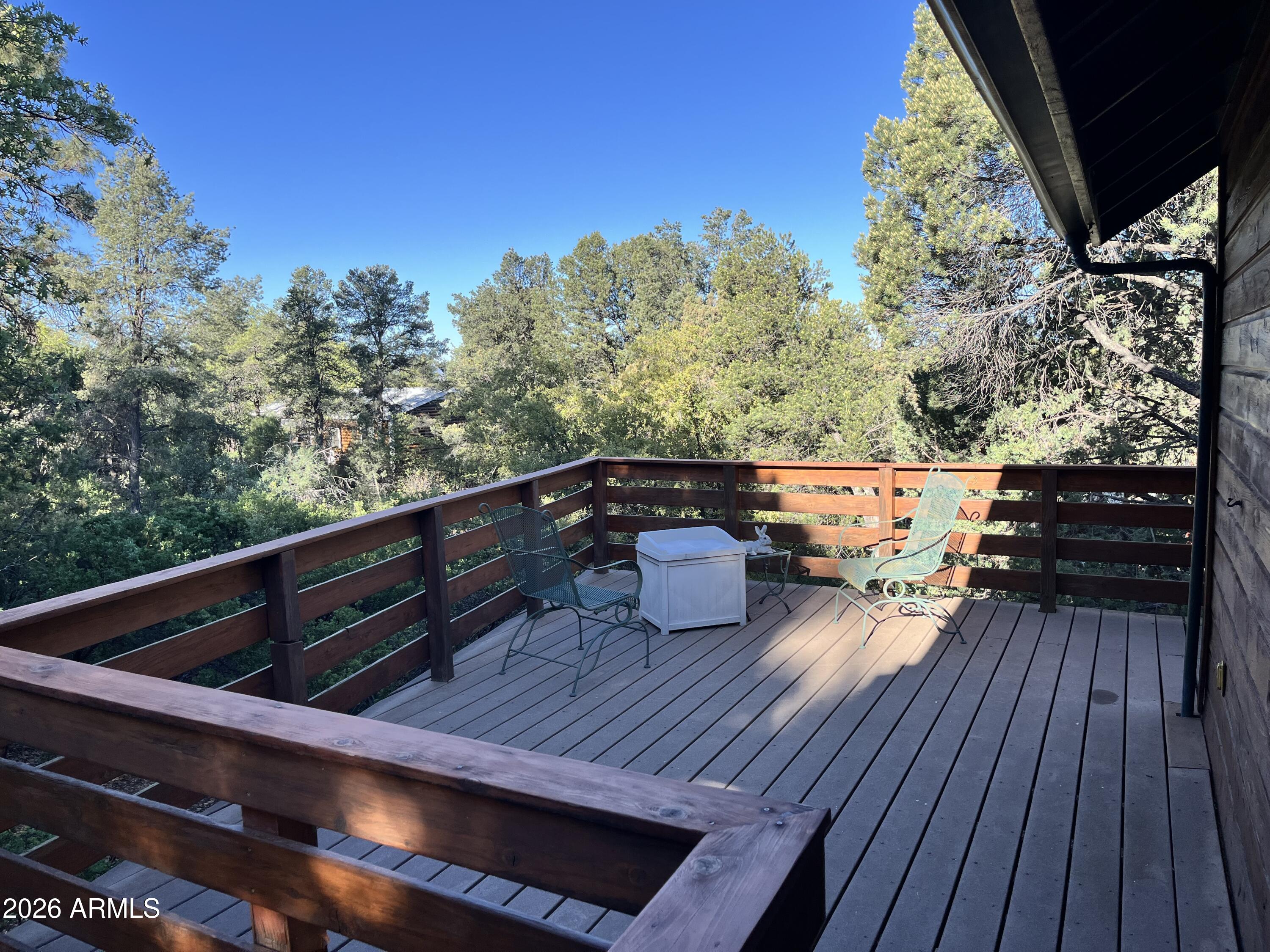 1006 North Matterhorn Road Payson, AZ 85541 - Photo 4 of 37 a balcony with wooden floor and outdoor seating