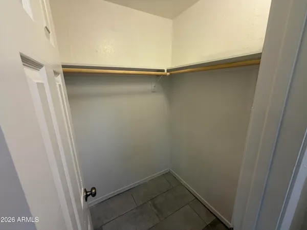a view of an empty walk in closet