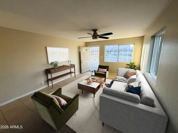 a living room with furniture and a window