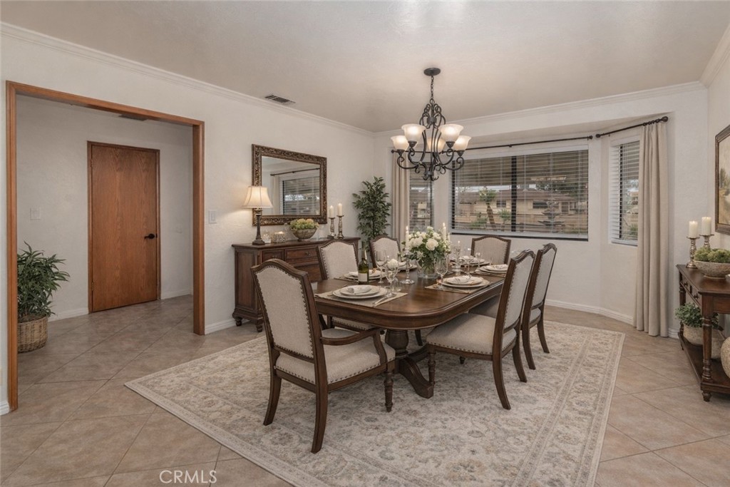 14760 Keota Road Apple Valley, CA 92307 - Photo 12 of 34 a view of a dining room with furniture and chandelier
