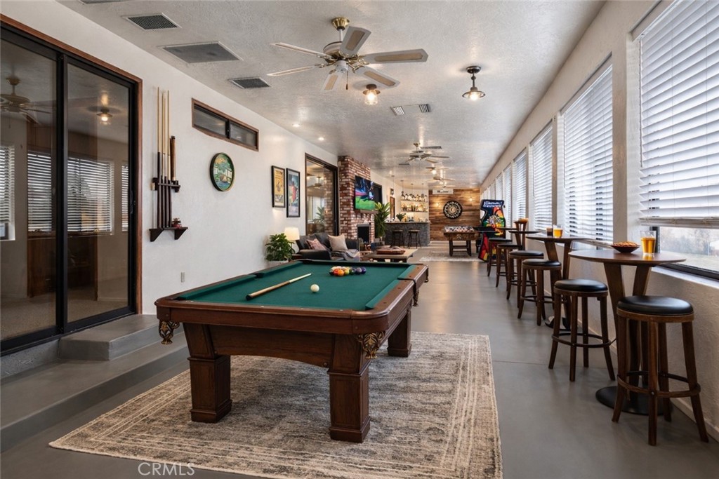 14760 Keota Road Apple Valley, CA 92307 - Photo 20 of 34 a room with lots of chairs and a table