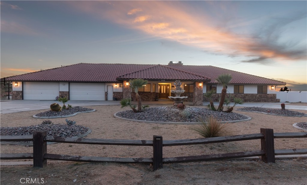 14760 Keota Road Apple Valley, CA 92307 - Photo 5 of 34 a backyard of a house with barbeque oven table and chairs