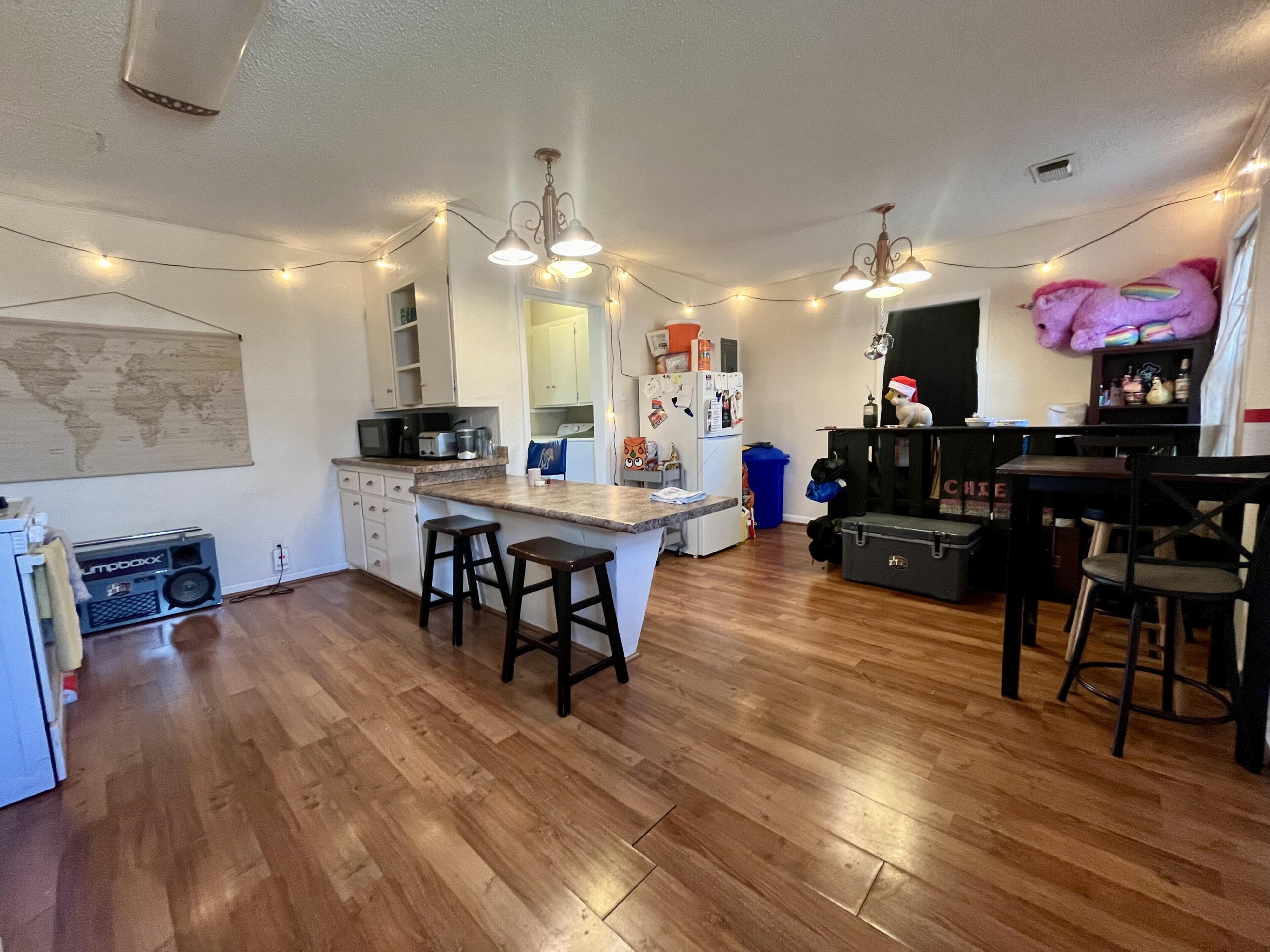 1724 28th Street Lubbock, TX 79411 - Photo 11 of 25 a view of a dining room with furniture and chandelier